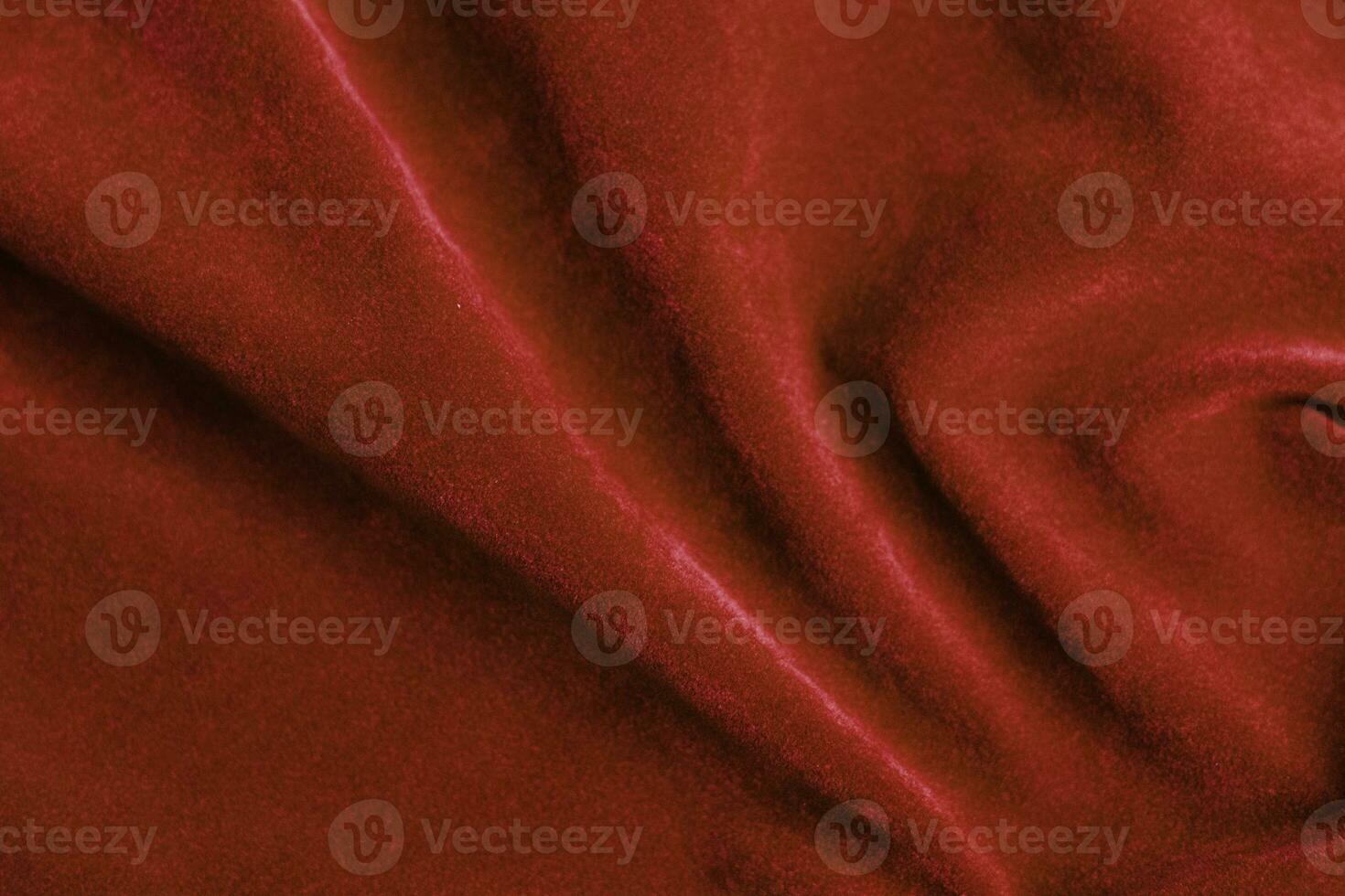 rojo terciopelo tela textura usado como antecedentes. rojo tela antecedentes de suave y suave textil material. allí es espacio para texto. foto