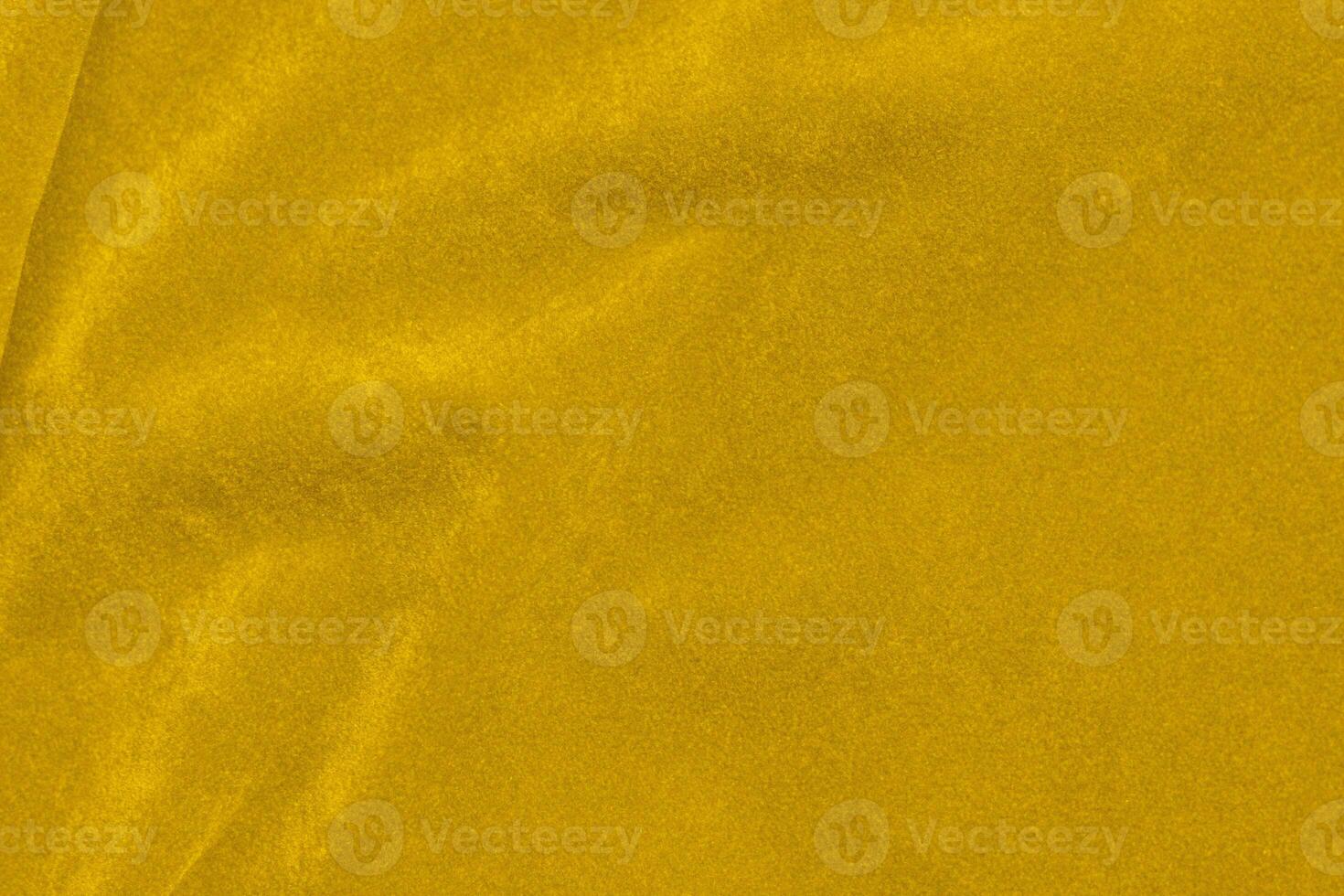 Yellow velvet fabric texture used as background. violet fabric background of soft and smooth textile material. There is space for text. photo