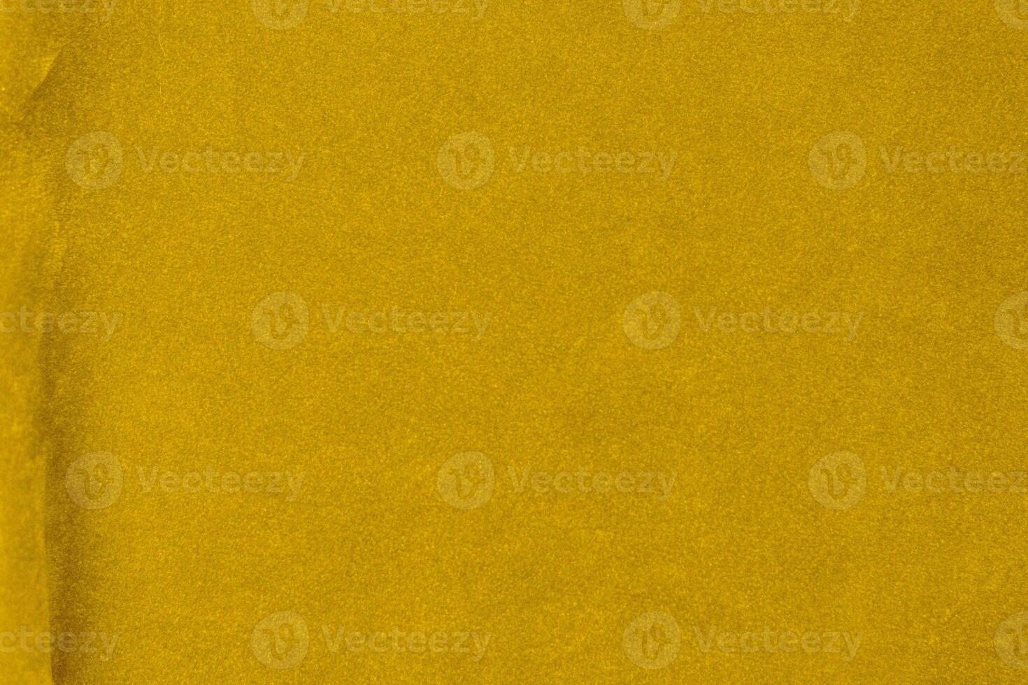 Yellow velvet fabric texture used as background. violet fabric background of soft and smooth textile material. There is space for text. photo