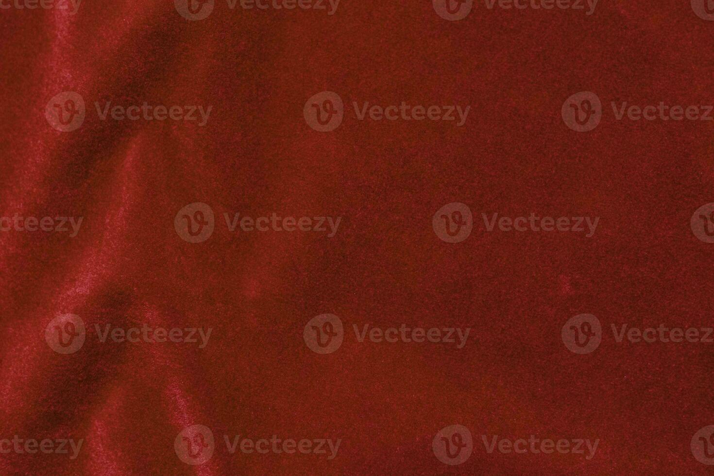 Red velvet fabric texture used as background. red fabric background of soft and smooth textile material. There is space for text. photo