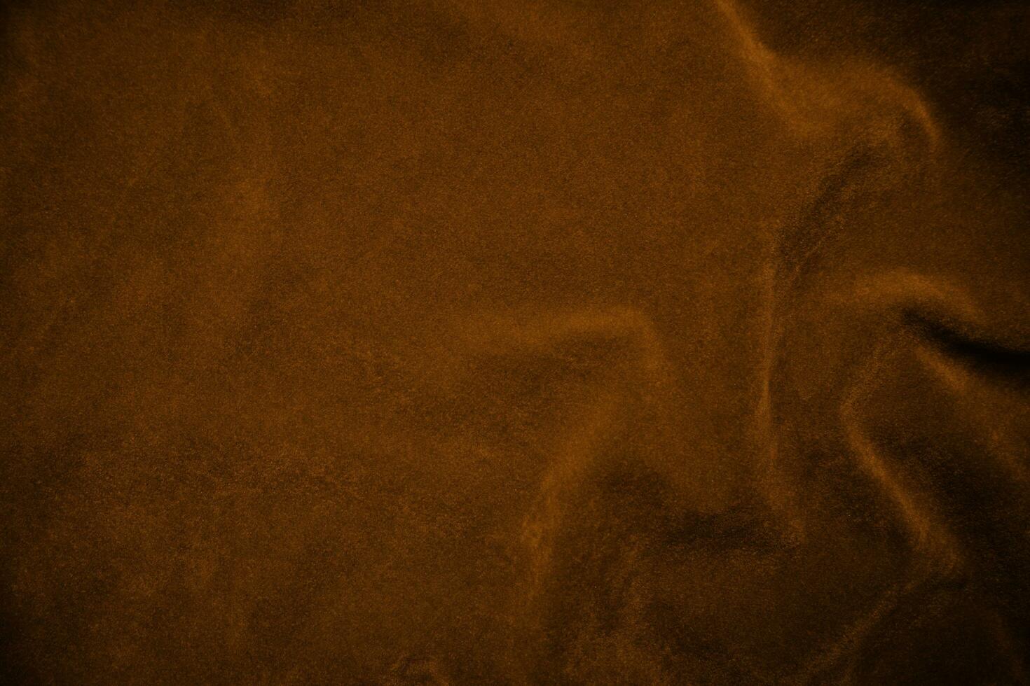 Orange velvet fabric texture used as background. orange fabric background of soft and smooth textile material. There is space for text. photo