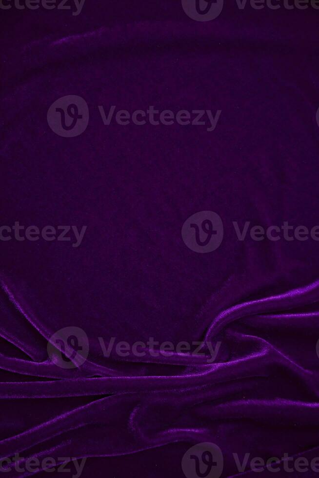 Purple velvet fabric texture used as background. Violet color panne fabric background of soft and smooth textile material. crushed velvet .luxury magenta tone for silk. photo