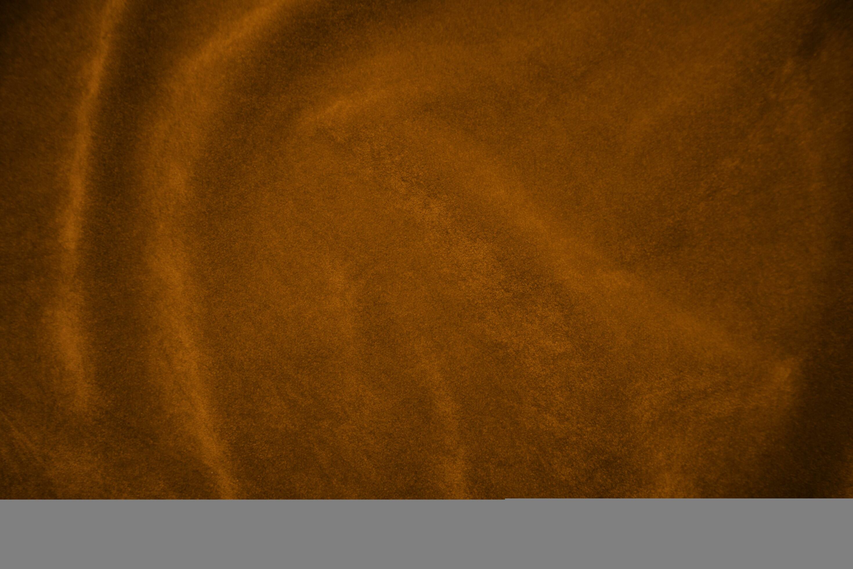Orange velvet fabric texture used as background. orange fabric