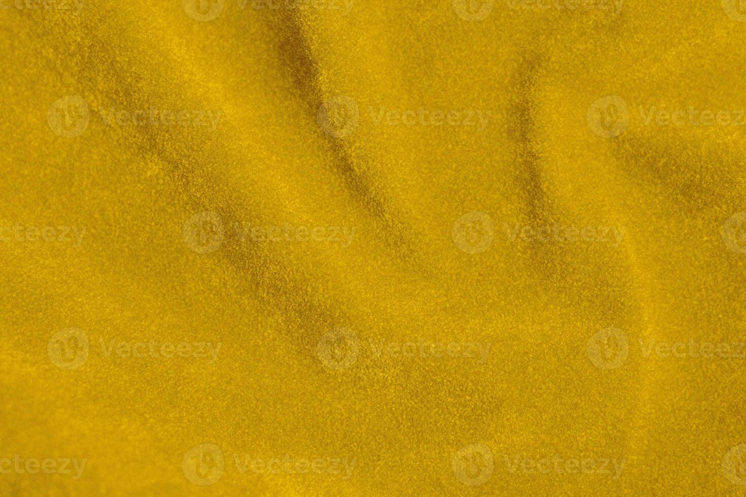 Yellow velvet fabric texture used as background. violet fabric background of soft and smooth textile material. There is space for text. photo