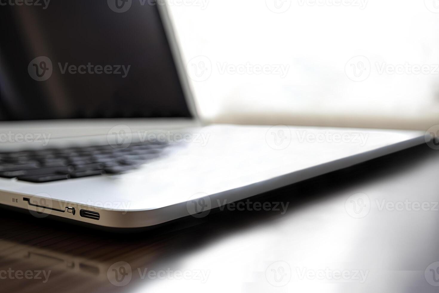 Closeup Image of Portable Laptop at Brown Wooden Table in Shiny Room. Internet Technology Representing the idea of Online Work or Home Business. photo