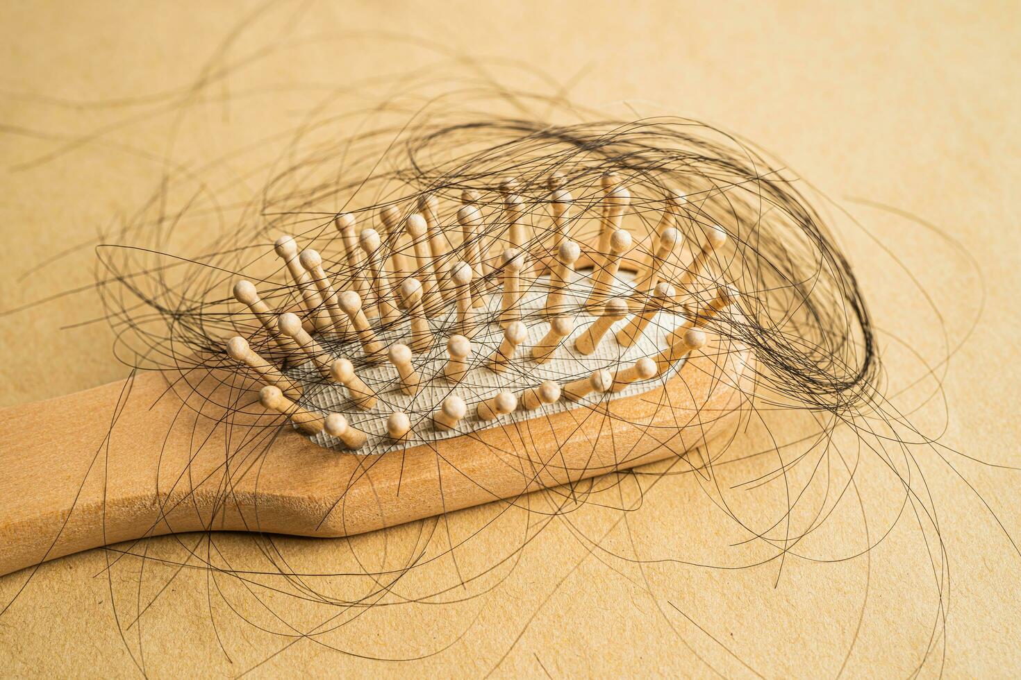 Hair loss fall with comb bush serious problem health, beauty and cosmetic concept. photo