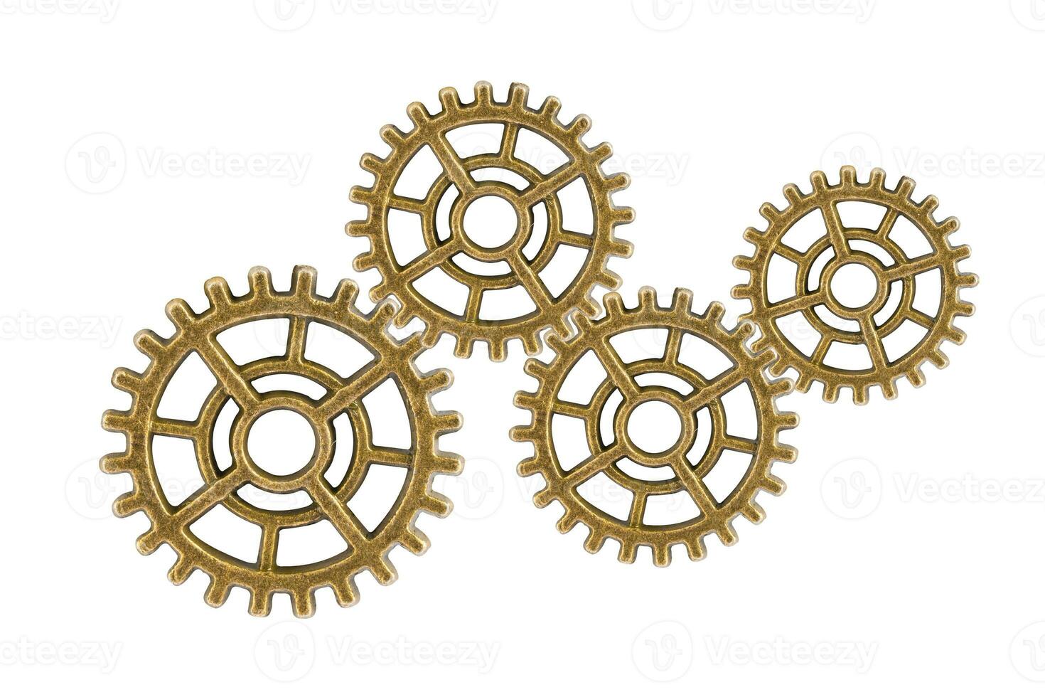 Gear and cogs wheels isolated on a white background, clock mechanism, brass metal engine industrial. photo