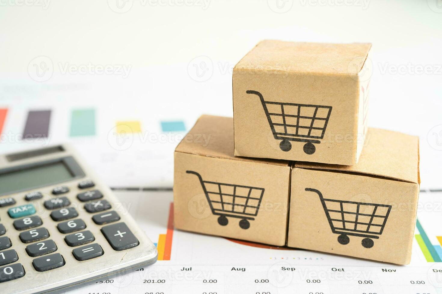 Shopping cart logo on box with magnifying glass on graph background. Banking Account, Investment Analytic research data economy, trading, Business import export transportation online company concept. photo