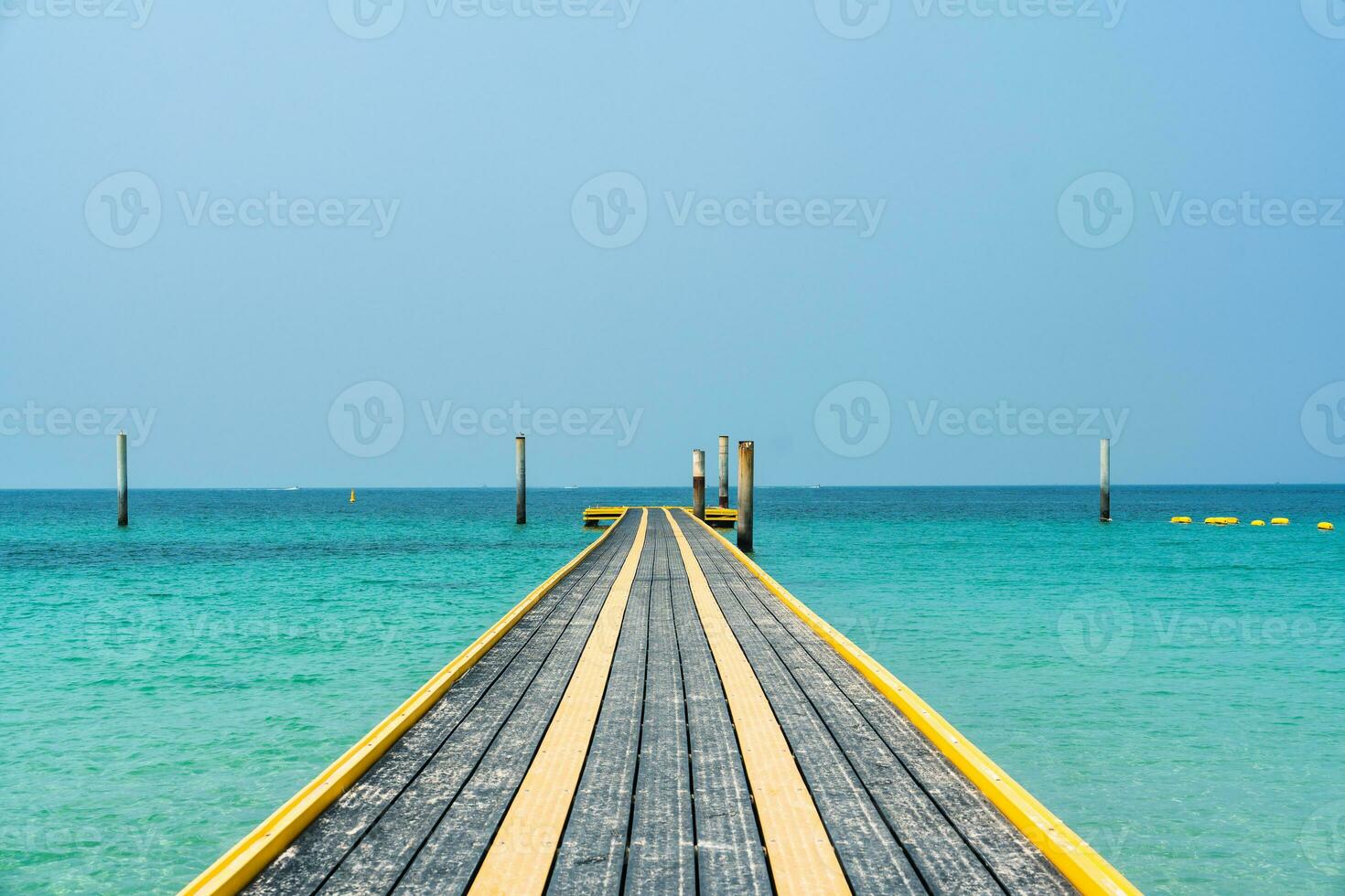 Pontoon walkway floating with pillar on tropical sea photo