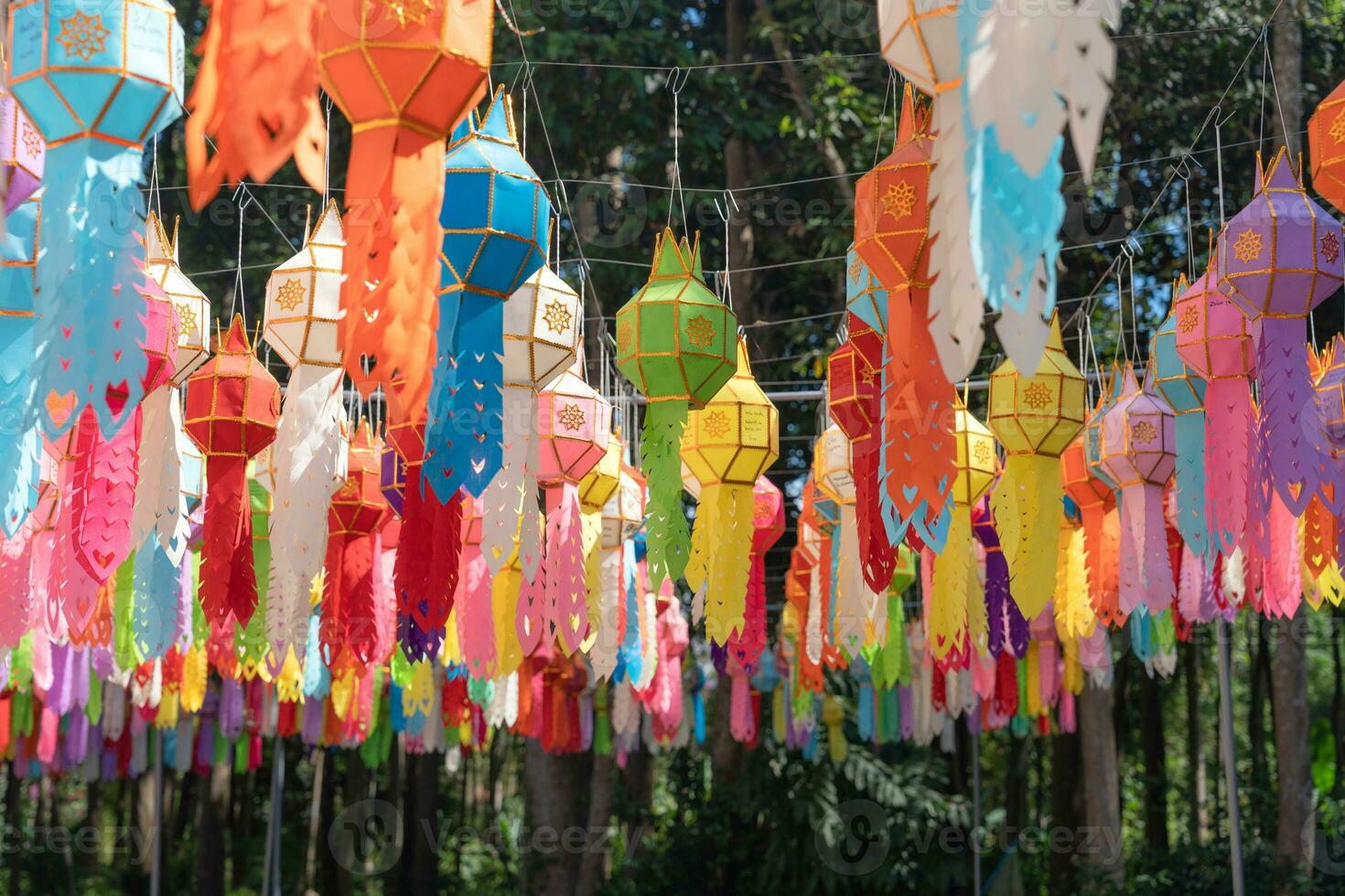 Traditional of multicolor paper lantern or Yi Peng Lanna hanging decorate in buddhist temple photo