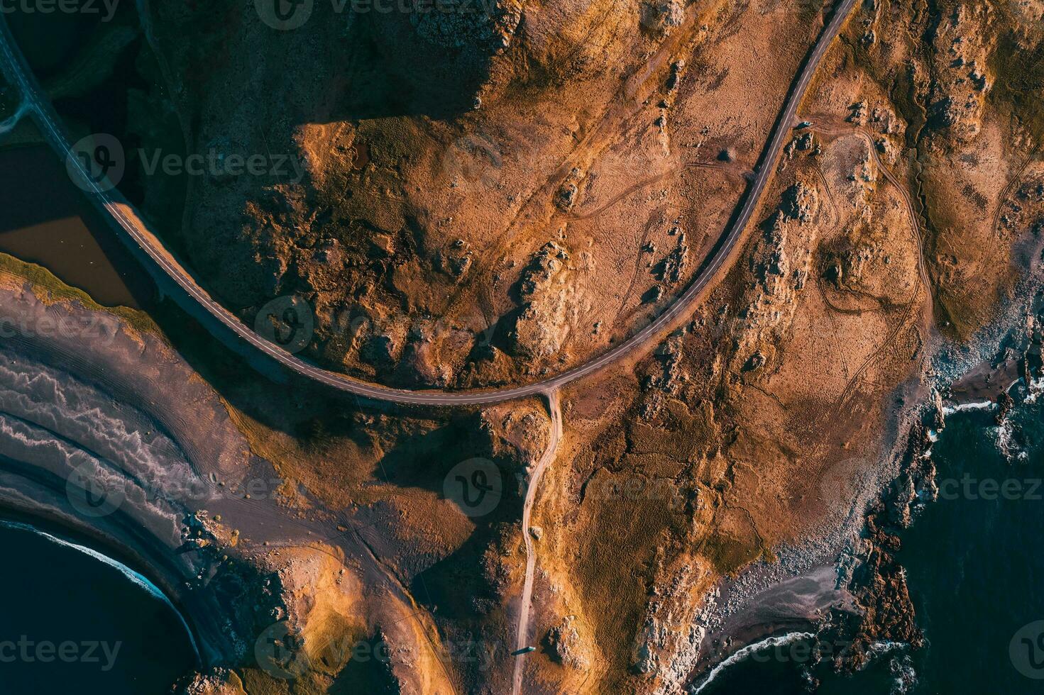 Winding highway on rogged geological area by atlantic peninsula in summer at Iceland photo