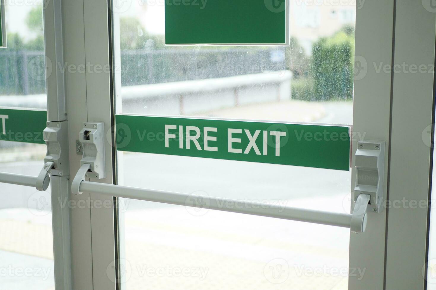 exit sign on brick wall photo