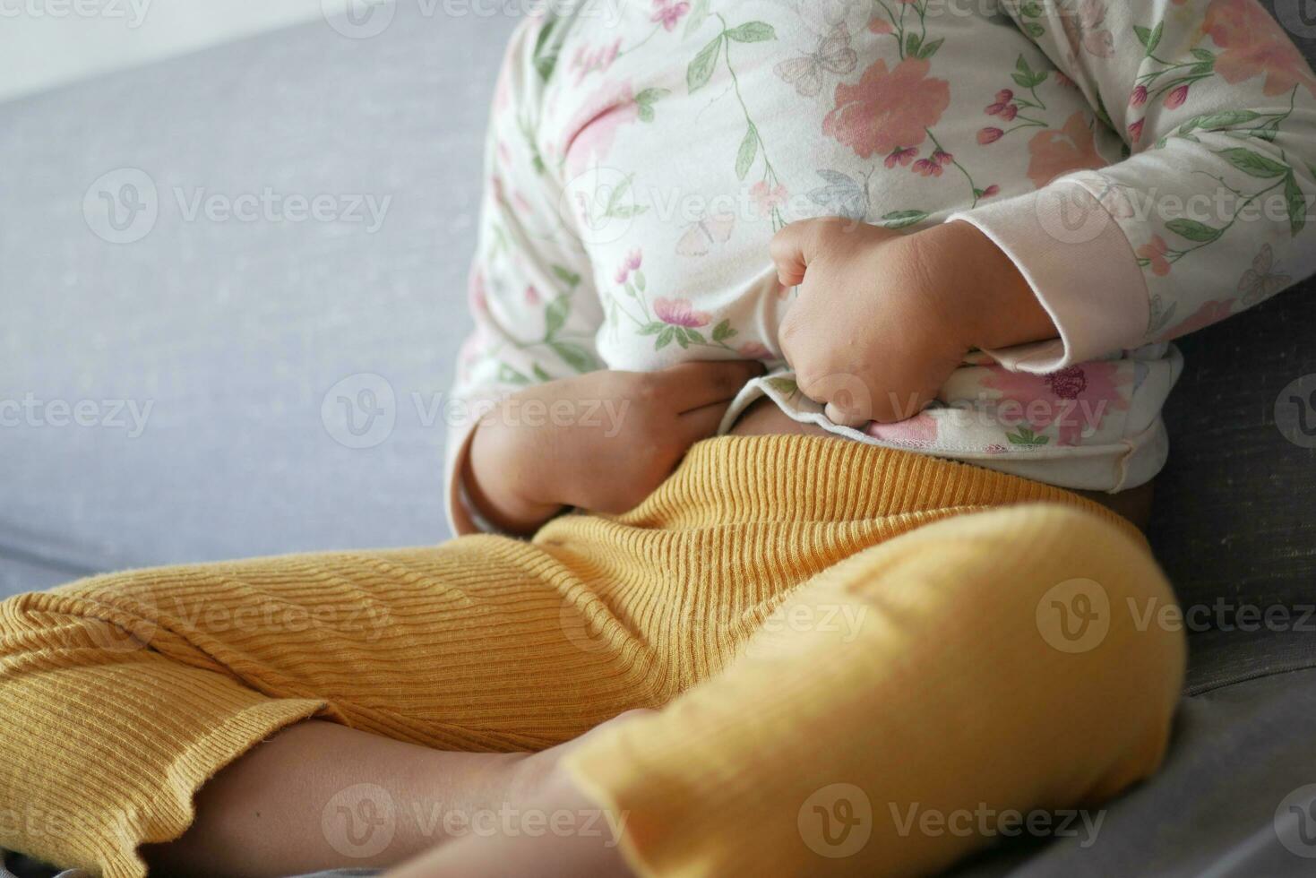 child suffering stomach pain close up. photo