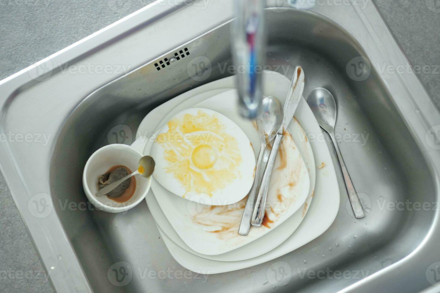 Dirty dishes in the sink photo