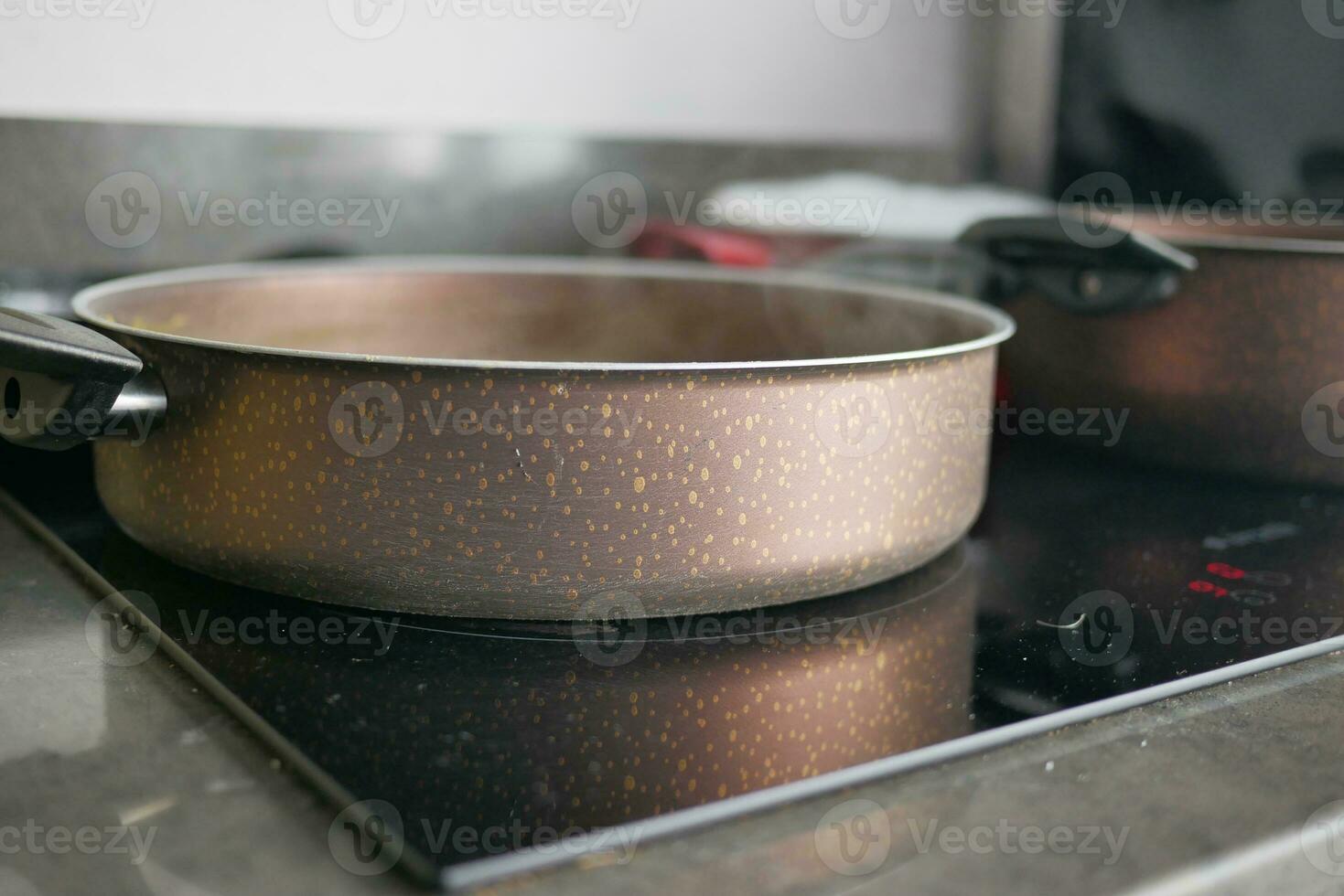 cooking pan on electric stove, electric stove is heated to red. photo