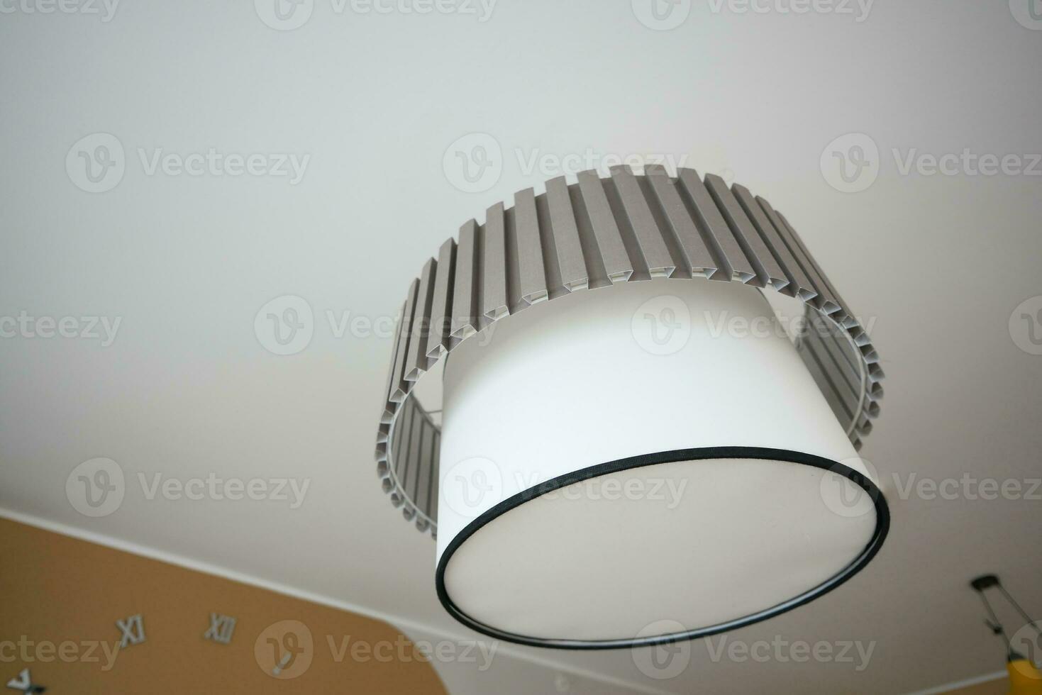 gray ceiling lamp hanging in a room , photo