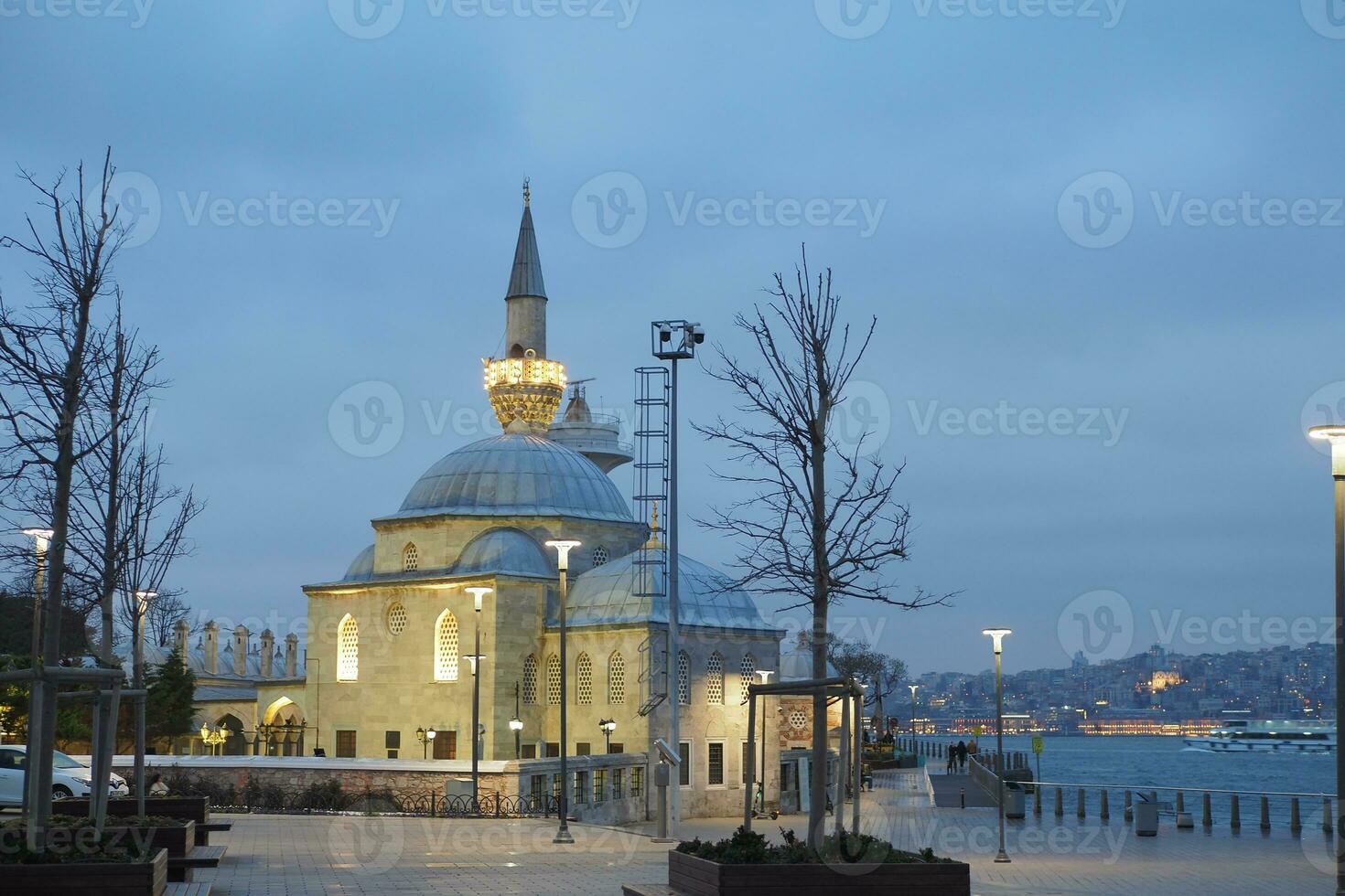 a beautiful mosque in a dark cloudy weather at night photo