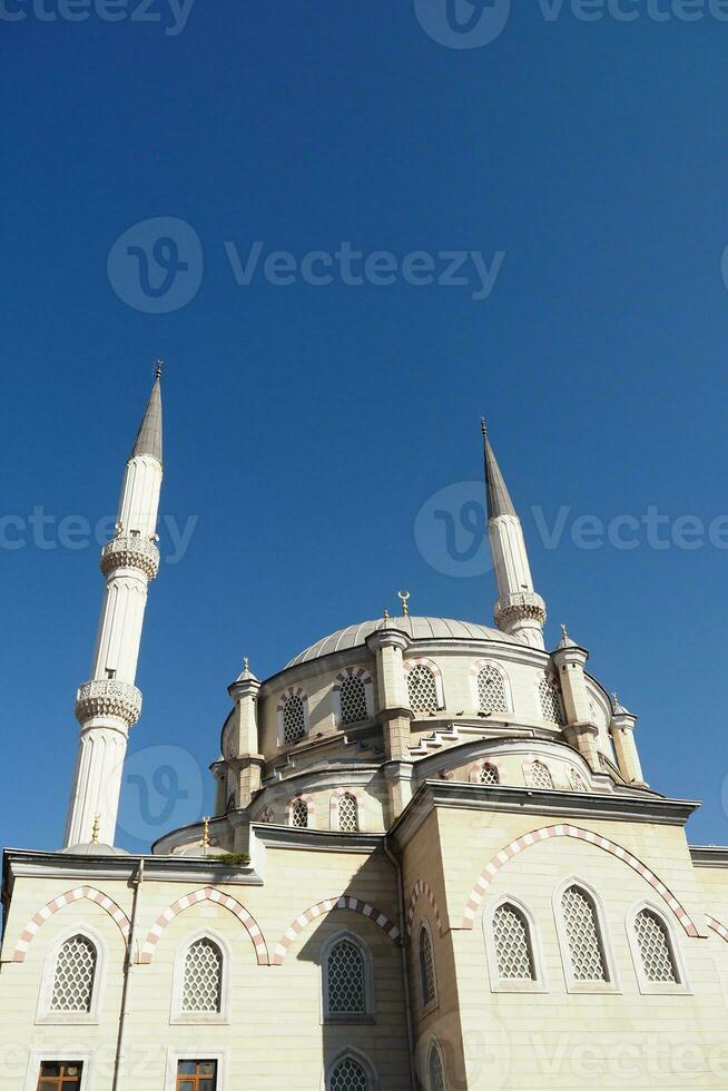 a beautiful mosque in istanbul against blue sky photo