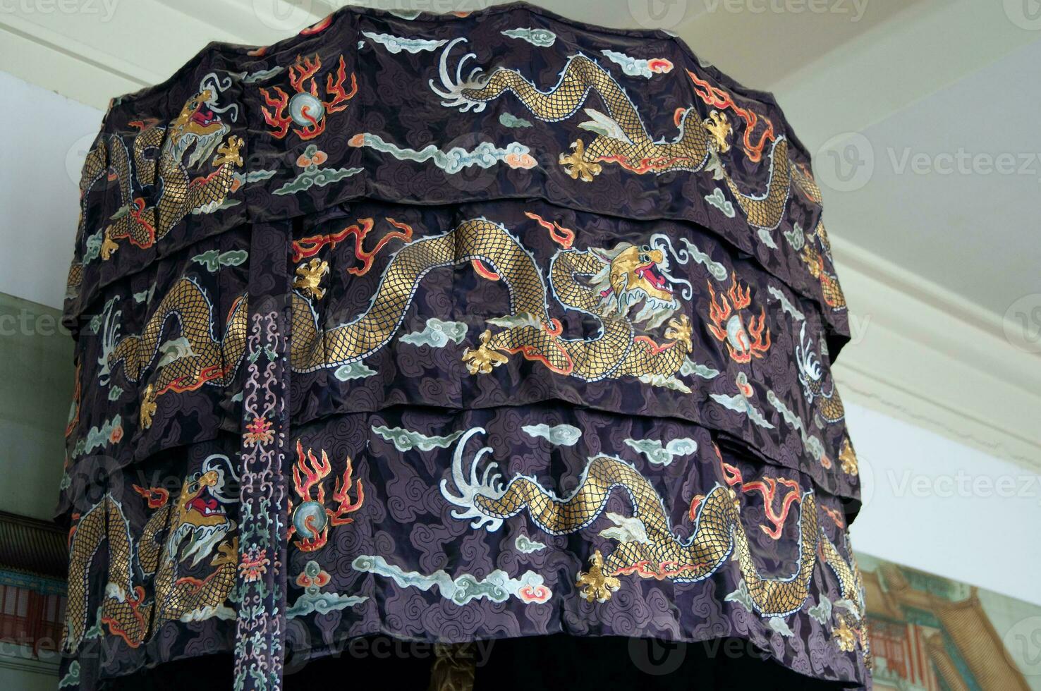 Chinese textile with orange dragons with blue background photo