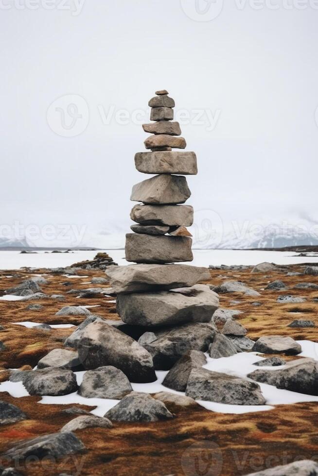 A minimalist Inukshuk made of piled stones pointing the way across the Alaskan tundra. AI generative photo