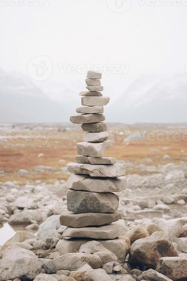 A minimalist Inukshuk made of piled stones pointing the way across the Alaskan tundra. photo