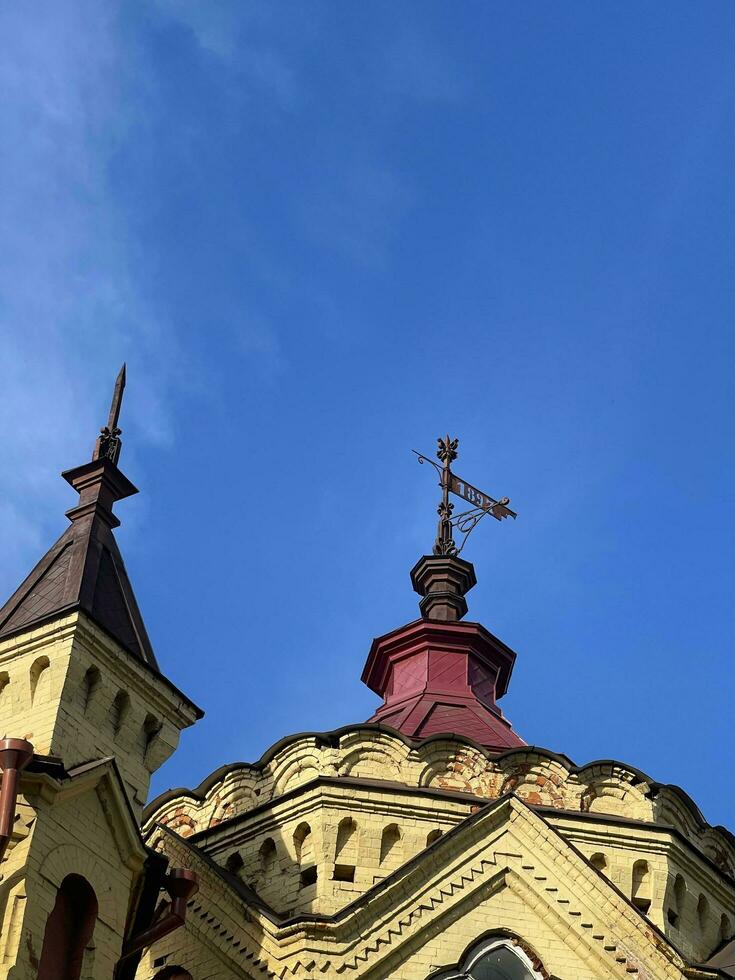 18 of July 2022 - Irkutsk, Russia. City Palace of Children's and Youth Creativity. Building spire against the blue sky. photo