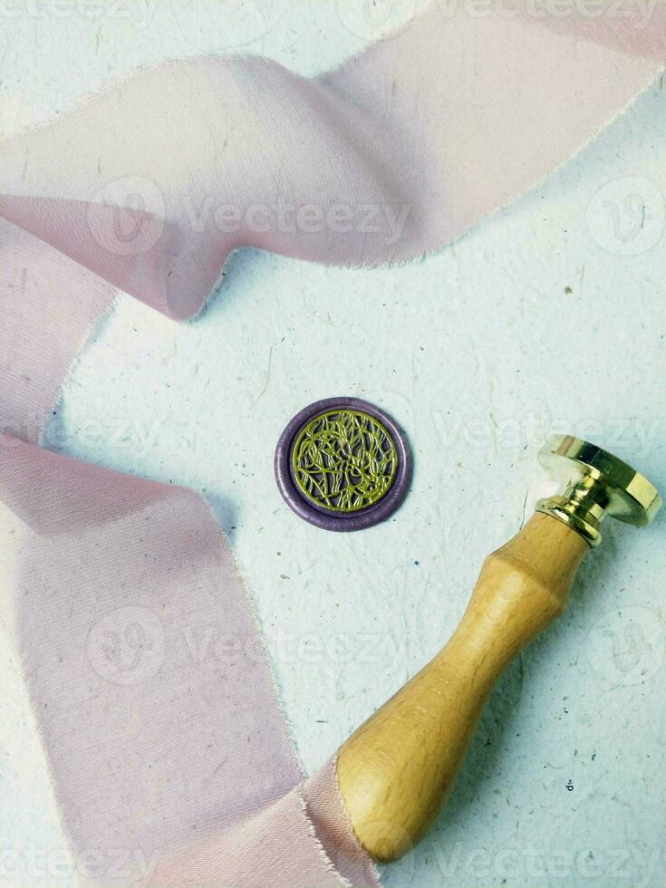 colorful wax coin made from wax sealing stamp for vintage look for letter or wedding invitation photo