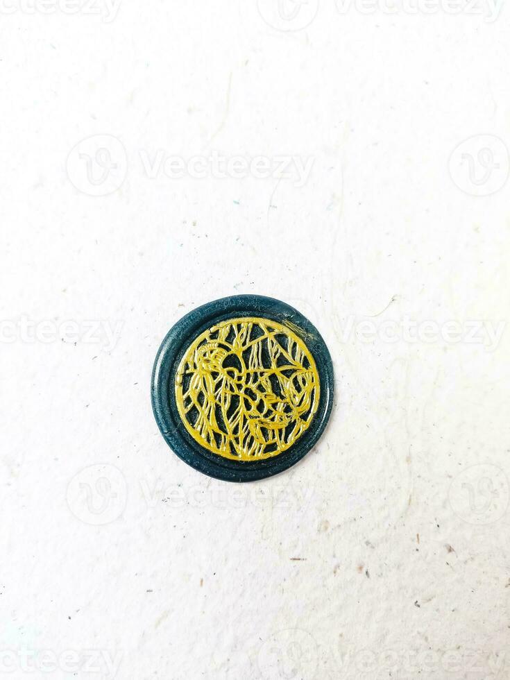 colorful wax coin made from wax sealing stamp for vintage look for letter or wedding invitation photo