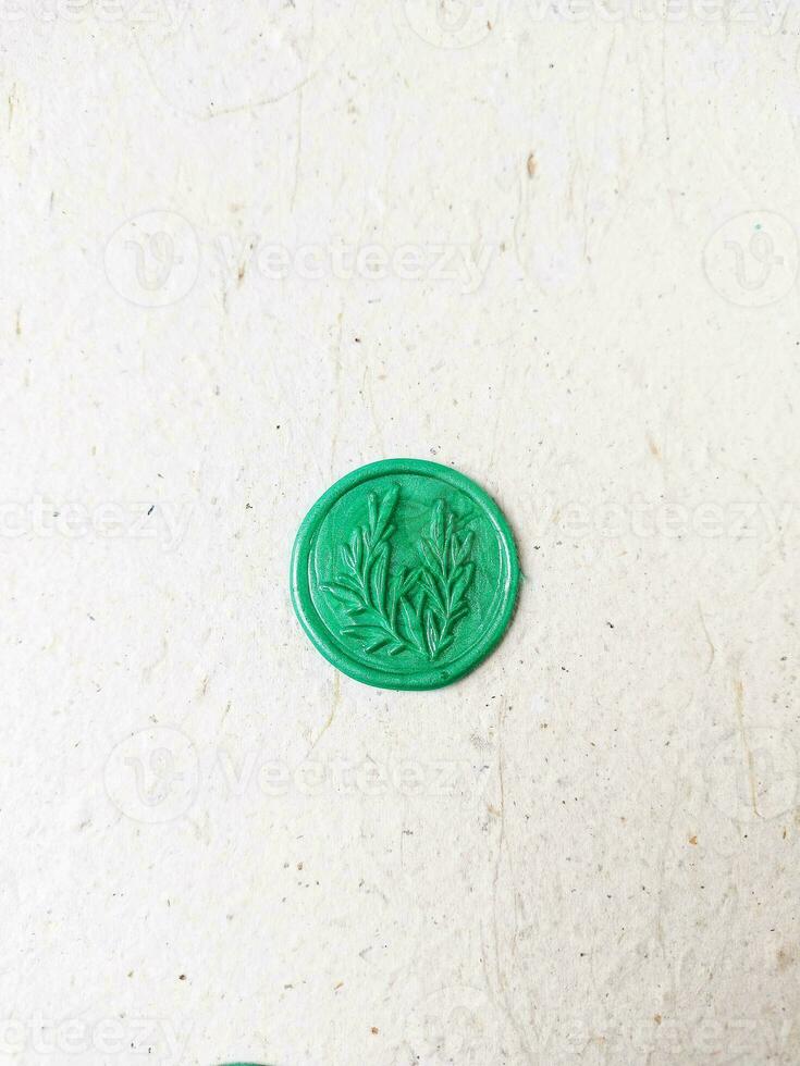 colorful wax coin made from wax sealing stamp for vintage look for letter or wedding invitation photo