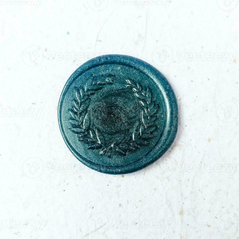 colorful wax coin made from wax sealing stamp for vintage look for letter or wedding invitation photo