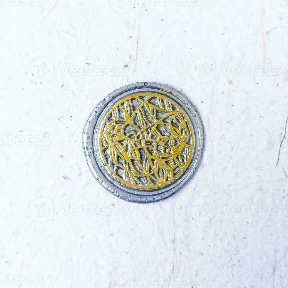 colorful wax coin made from wax sealing stamp for vintage look for letter or wedding invitation photo