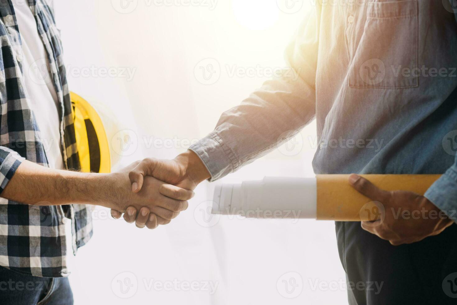 Construction and structure concept of Engineer or architect meeting for project working with partner and engineering tools on model building and blueprint in working site, contract for both companies. photo