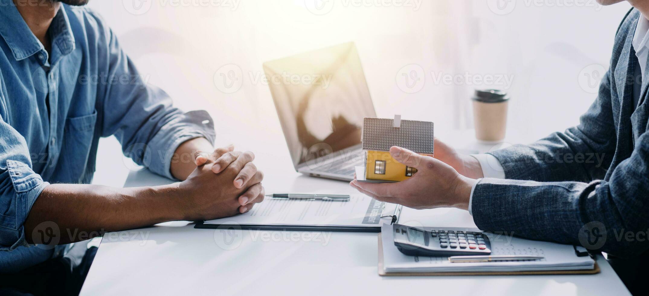 Real estate agent and customer signing contract to buy house, insurance or loan real estate.rent a house,get insurance or loan real estate or property. photo