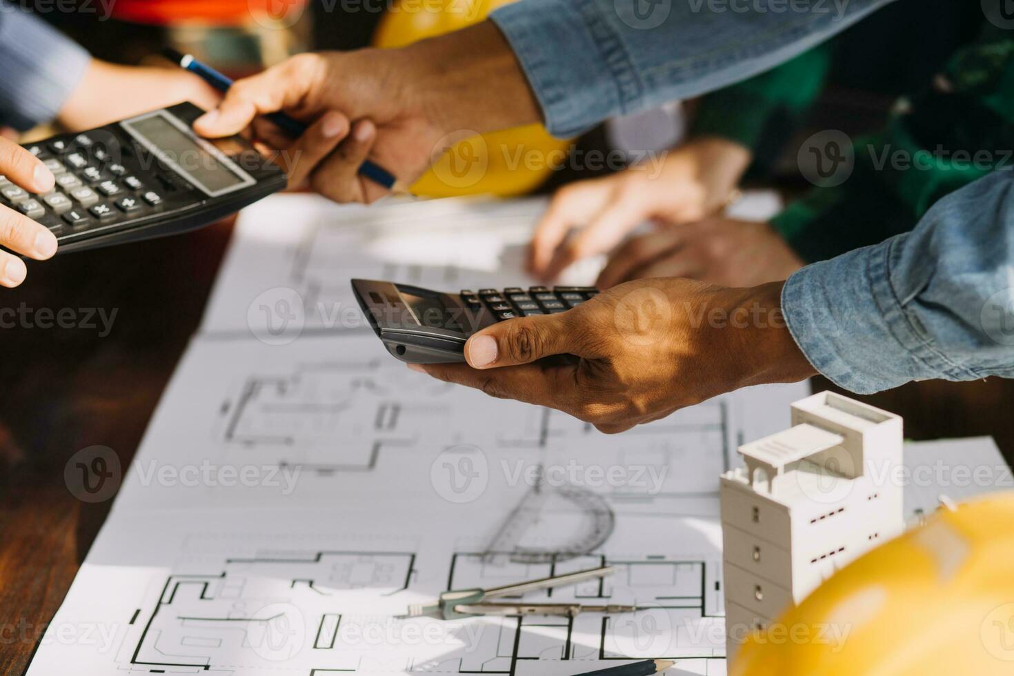 Construction and structure concept of engineer working drawing on blueprint meeting for project working with partner on model building and engineering tools in working site, construction concept. photo