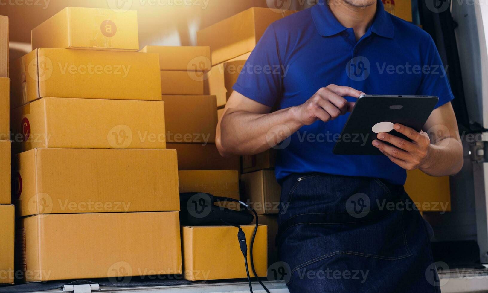 Entrepreneurs Small Business SME Independent men work at home Use smartphones and laptops for commercial checking, online marketing, packing boxes, SME sellers, concept, e-commerce team, online sales photo