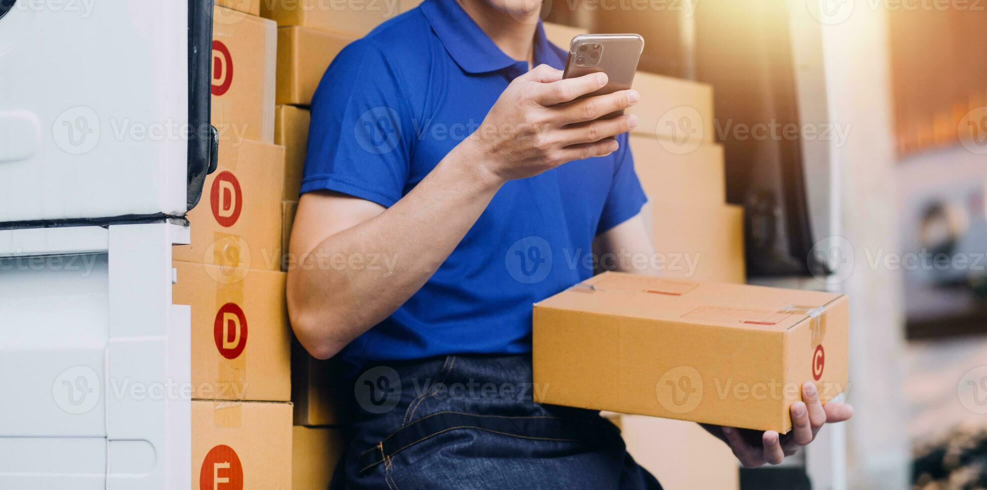 Entrepreneurs Small Business SME Independent men work at home Use smartphones and laptops for commercial checking, online marketing, packing boxes, SME sellers, concept, e-commerce team, online sales photo