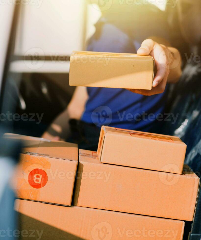 Entrepreneurs Small Business SME Independent men work at home Use smartphones and laptops for commercial checking, online marketing, packing boxes, SME sellers, concept, e-commerce team, online sales photo