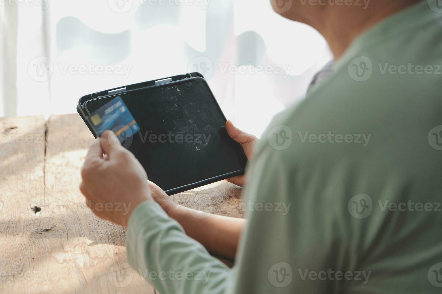 Close up mature man holding plastic credit card, senior couple family paying online, using laptop, satisfied older customers making secure internet payment, shopping, browsing banking service photo