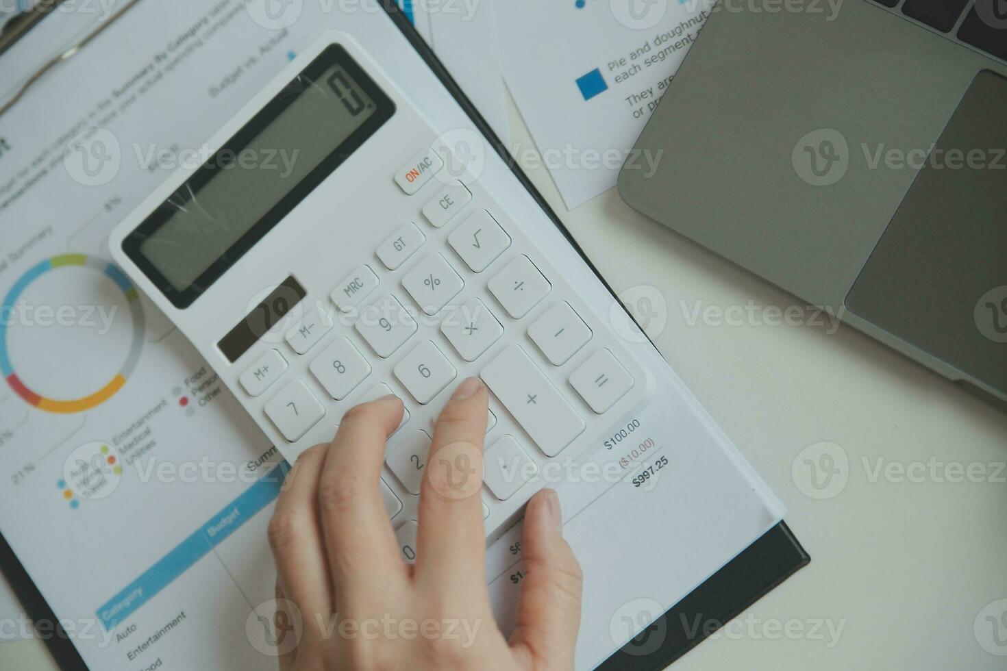 Close up businessman hand using calculator and working with laptop calculate about finance accounting at coffeeshop outdor.finance accounting concept photo