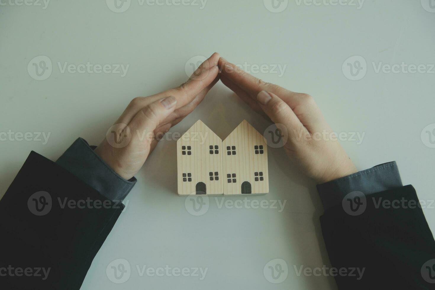 Female woman hands holding home model, small miniature white toy house. Mortgage property insurance dream moving home and real estate concept photo