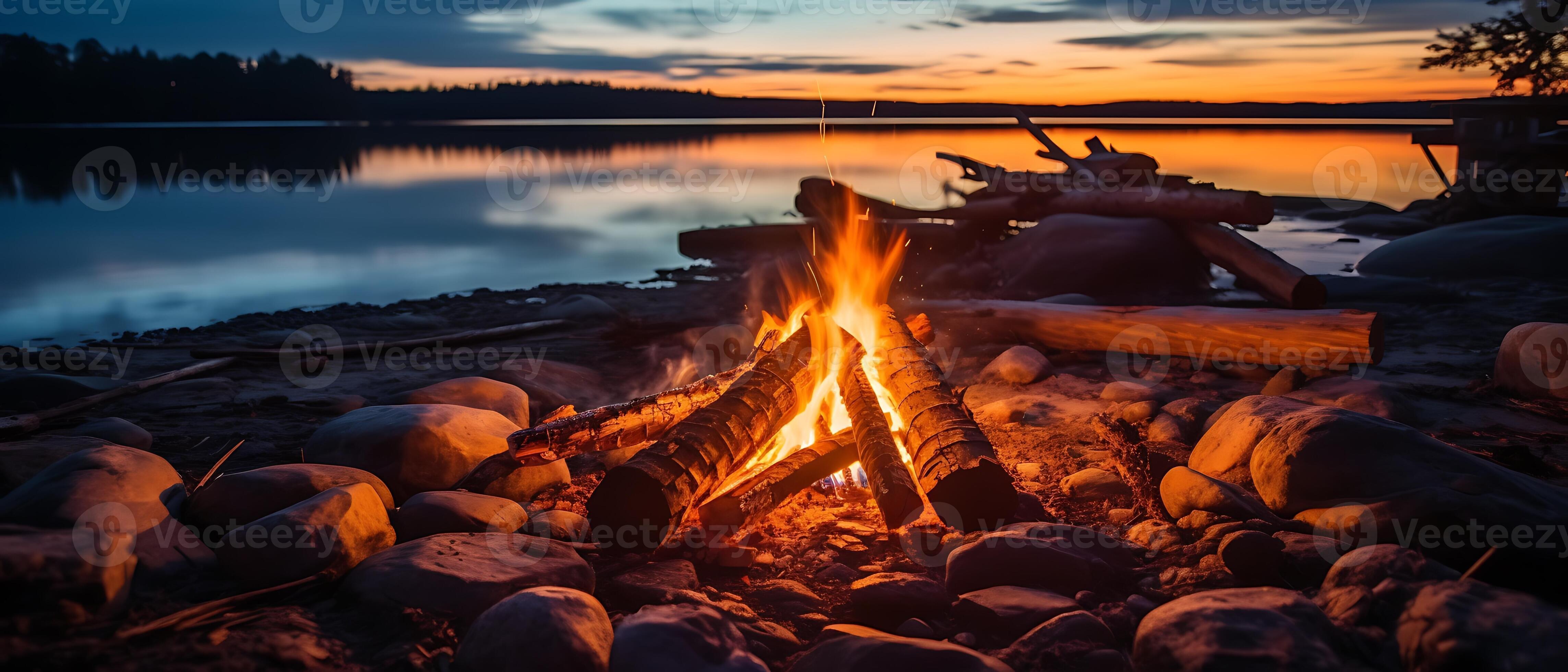 Experience a glowing campfire by the lake, with a stunning sunset and