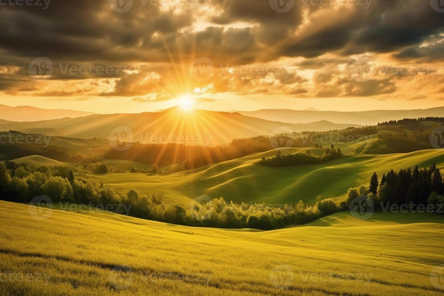 The sun rises over a hillside with grassy fields and an area with a hill. photo