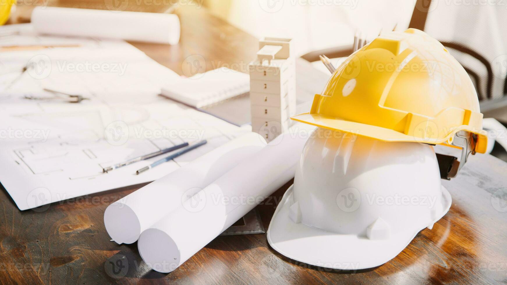 Construction and structure concept of engineer working drawing on blueprint meeting for project working with partner on model building and engineering tools in working site, construction concept. photo