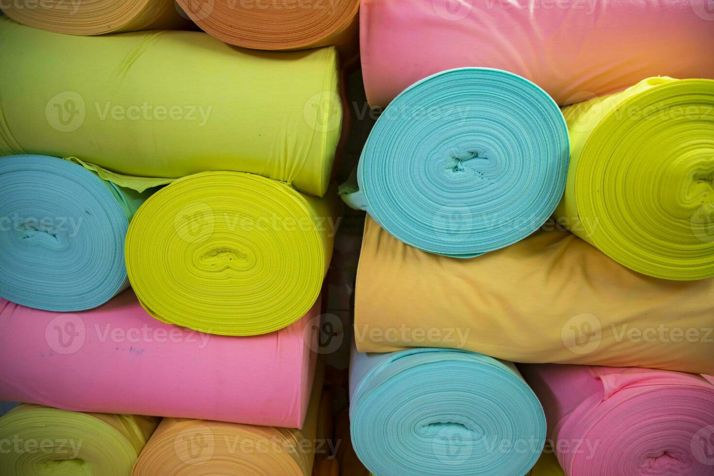 Artistic variety of shade tone colors Textile Fabrics rolls stacked pattern texture photo