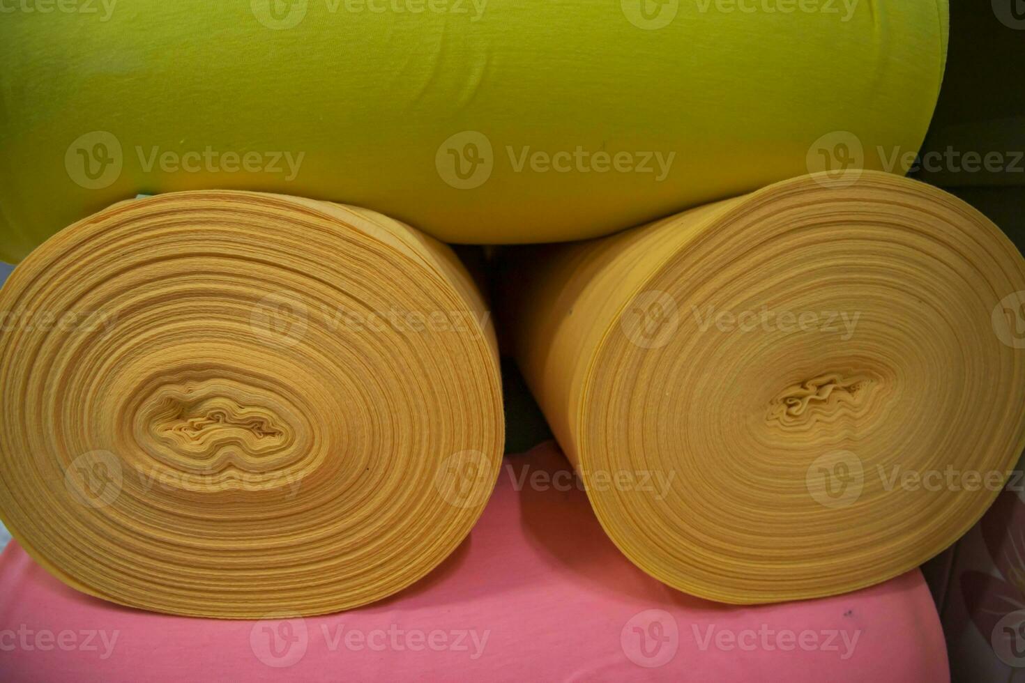 Artistic variety of shade tone colors Textile Fabrics rolls stacked pattern texture photo