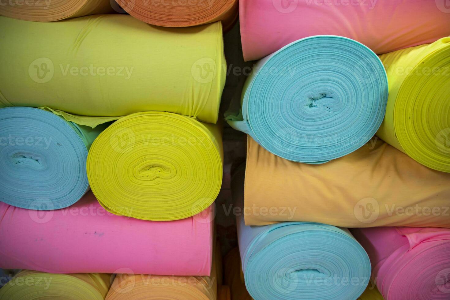 Artistic variety of shade tone colors Textile Fabrics rolls stacked pattern texture photo