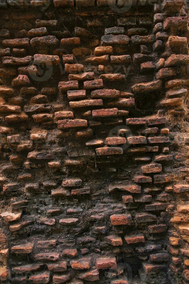 Old historical building brick wall grunge pattern texture can be used as a background wallpaper photo