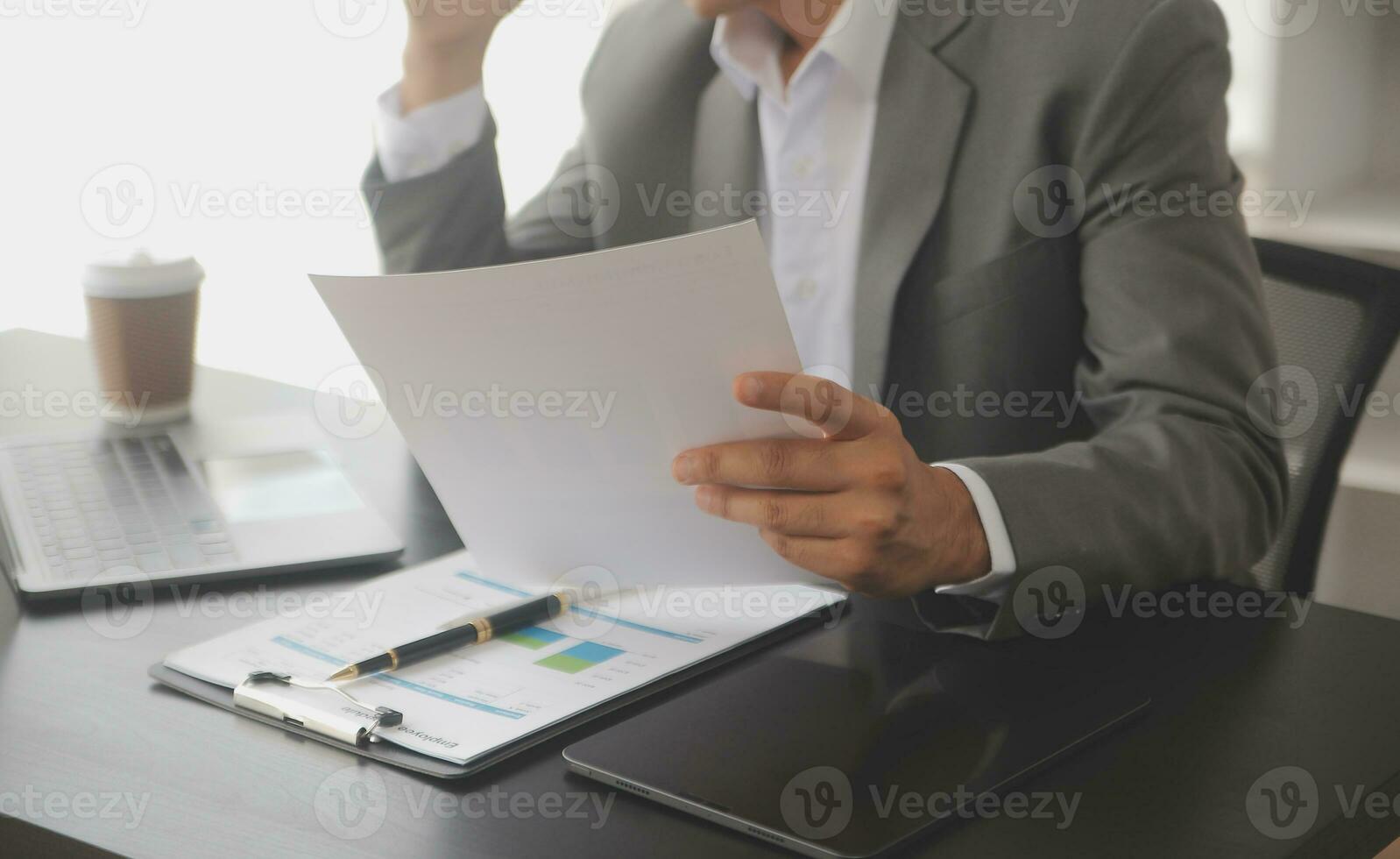 Businessmen are calculating income-expenditure and analyzing real estate investment data, Accounting Financial and tax systems concept. photo