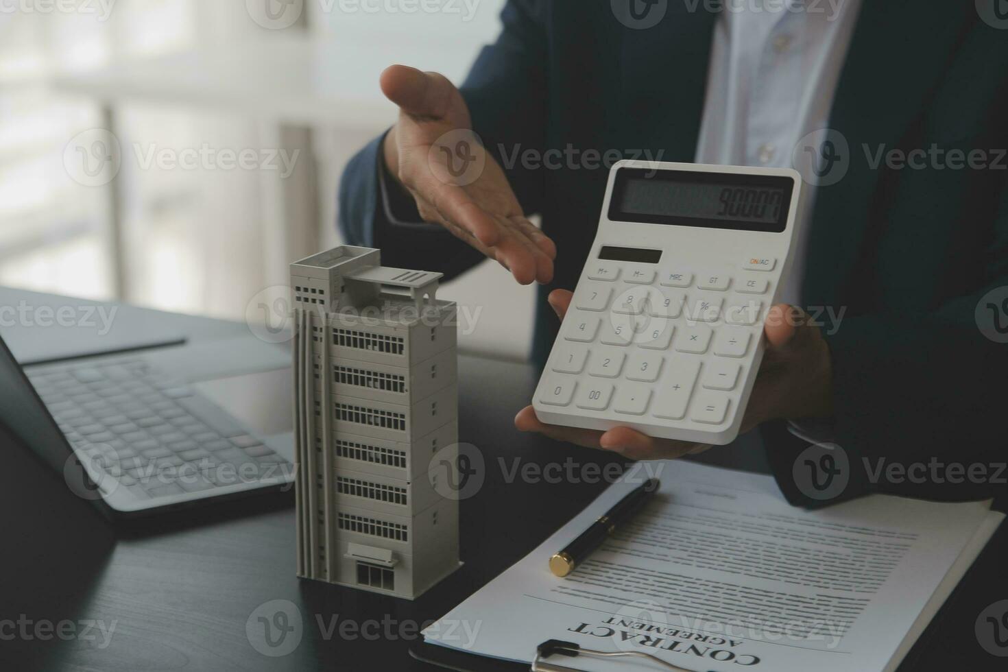 Real estate agent and customer signing contract to buy house, insurance or loan real estate.rent a house,get insurance or loan real estate or property. photo