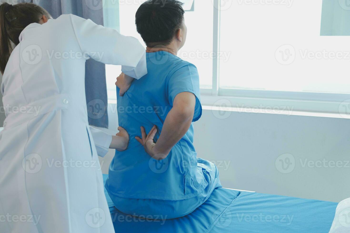 Patient doing some special exercises under supervision in a room photo